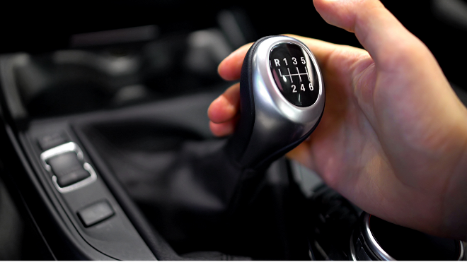 Person changing gear in a manual vehicle.